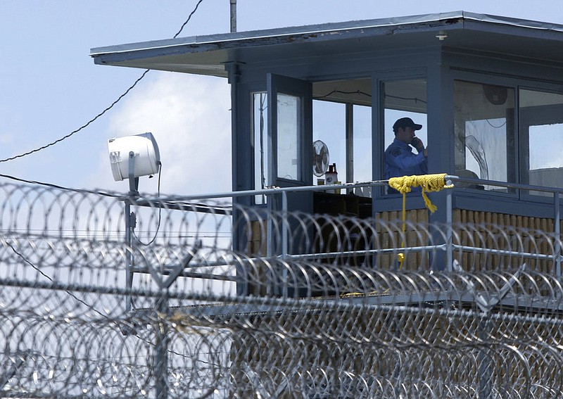 A guard is shown in a tower at the Arkansas Department of Corrections Tucker Unit near Tucker in this May 13, 2011 file photo. (AP/Danny Johnston)