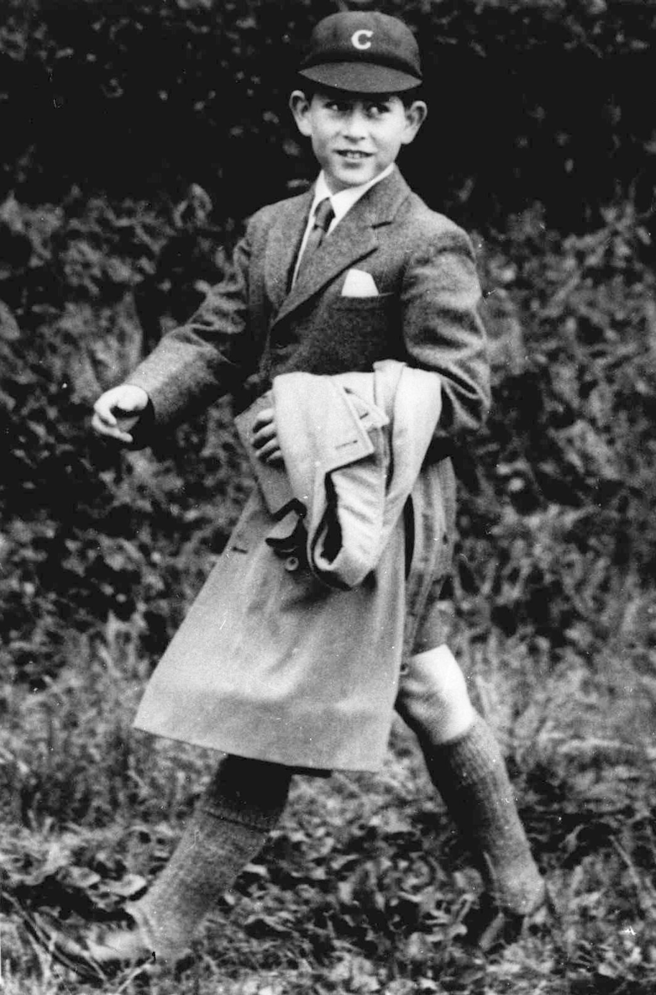 FILE - In this July 27, 1958 file photo, Britain's Prince Charles walks wearing his uniform. Prince Charles has been preparing for the crown his entire life. Now, that moment has finally arrived. Charles, the oldest person to ever assume the British throne, became king on Thursday Sept. 8, 2022, following the death of his mother, Queen Elizabeth II. (AP Photo, File)