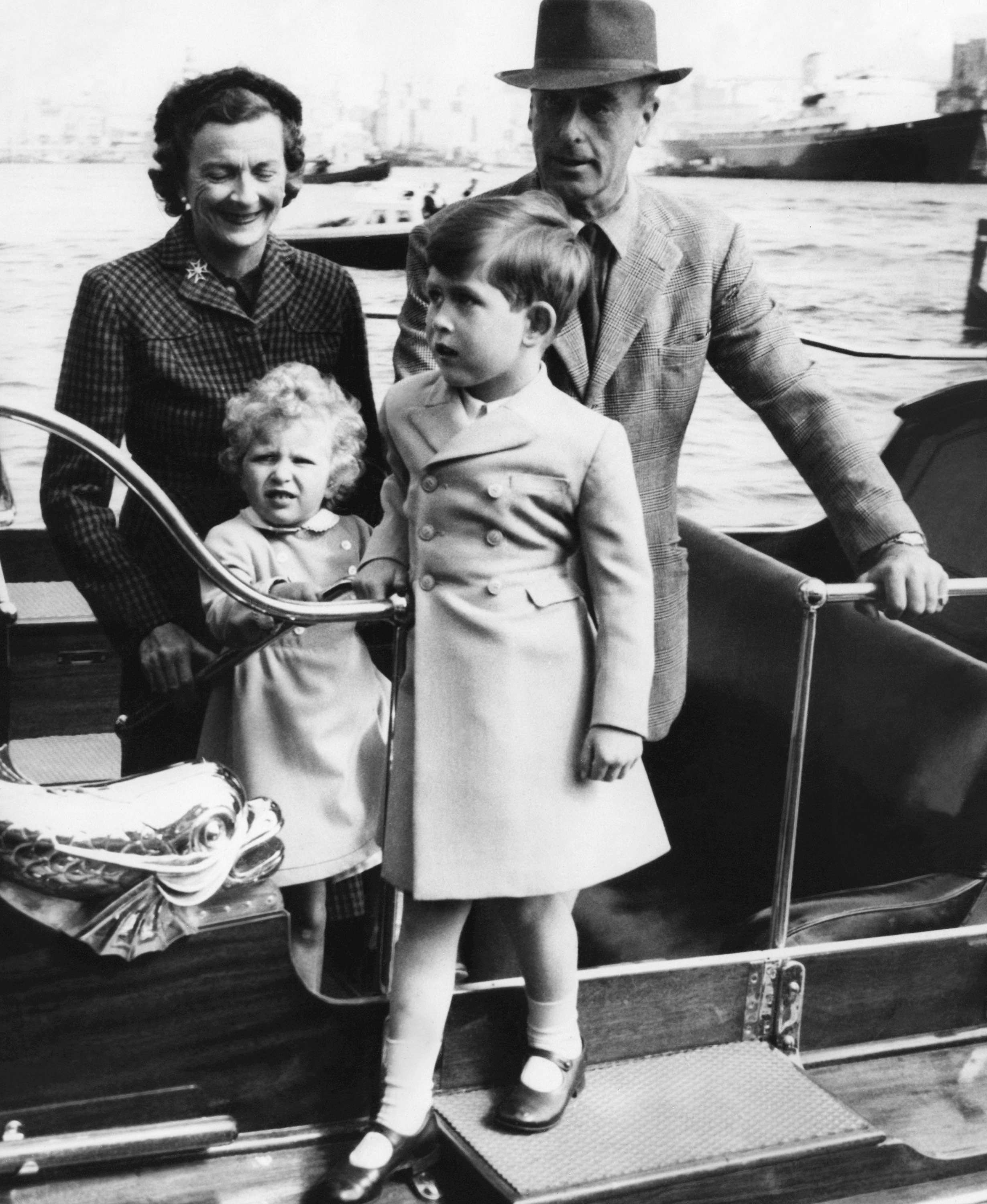 FILE - In this April 23, 1954 file photo, Britain's Prince Charles, and his sister, Princess Anne, are assisted by Admiral Earl Mountbatten and Lady Edwina Mountbatten as they step ashore at Customs House in the Grand Harbor at Malta.  Prince Charles has been preparing for the crown his entire life. Now, that moment has finally arrived. Charles, the oldest person to ever assume the British throne, became king on Thursday Sept. 8, 2022, following the death of his mother, Queen Elizabeth II. (AP Photo, File)