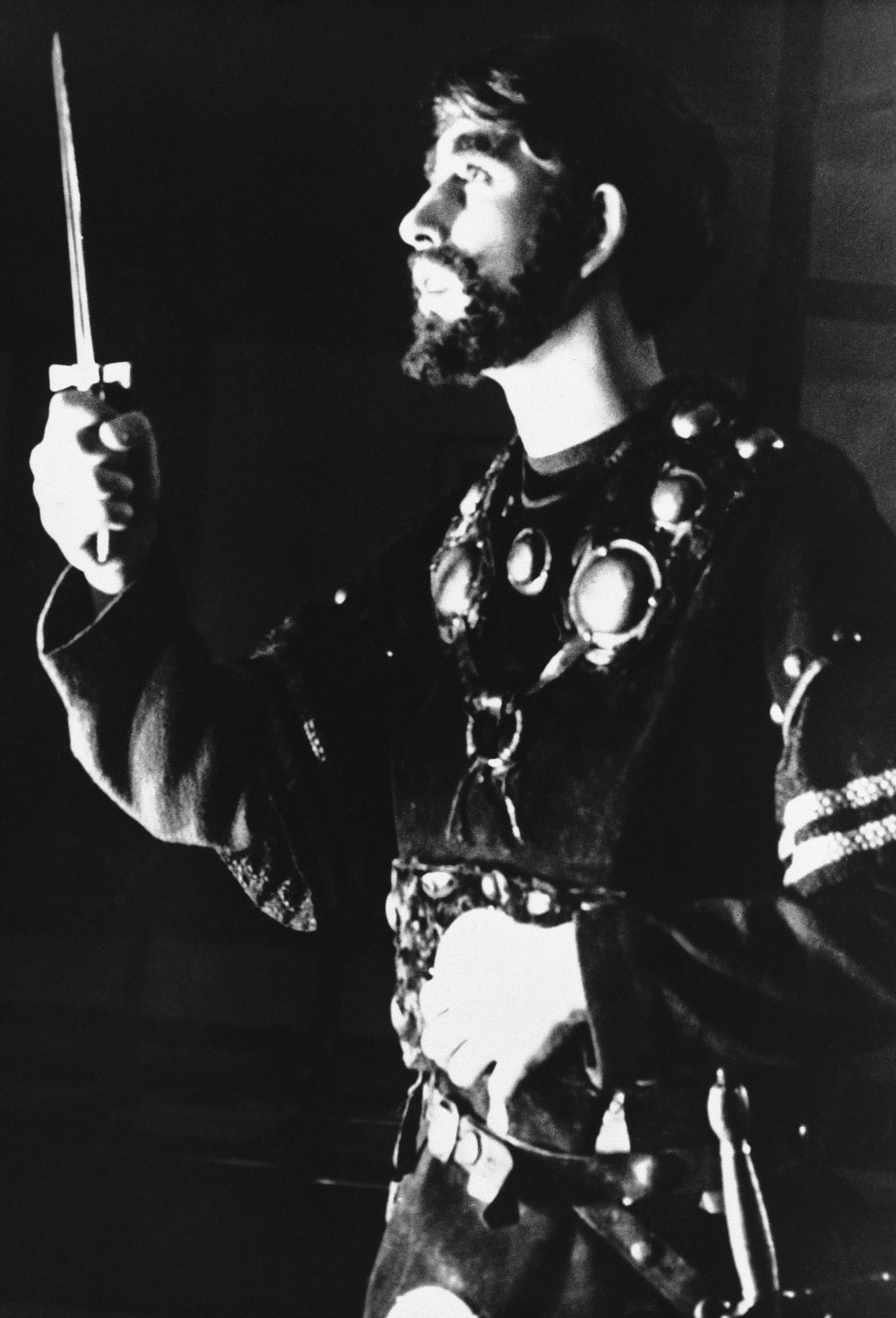 FILE - In this Nov. 1965 file photo, Britain's Prince Charles, gestures, during the dagger scene in Gordonstoun School's production of Shakespeare's 