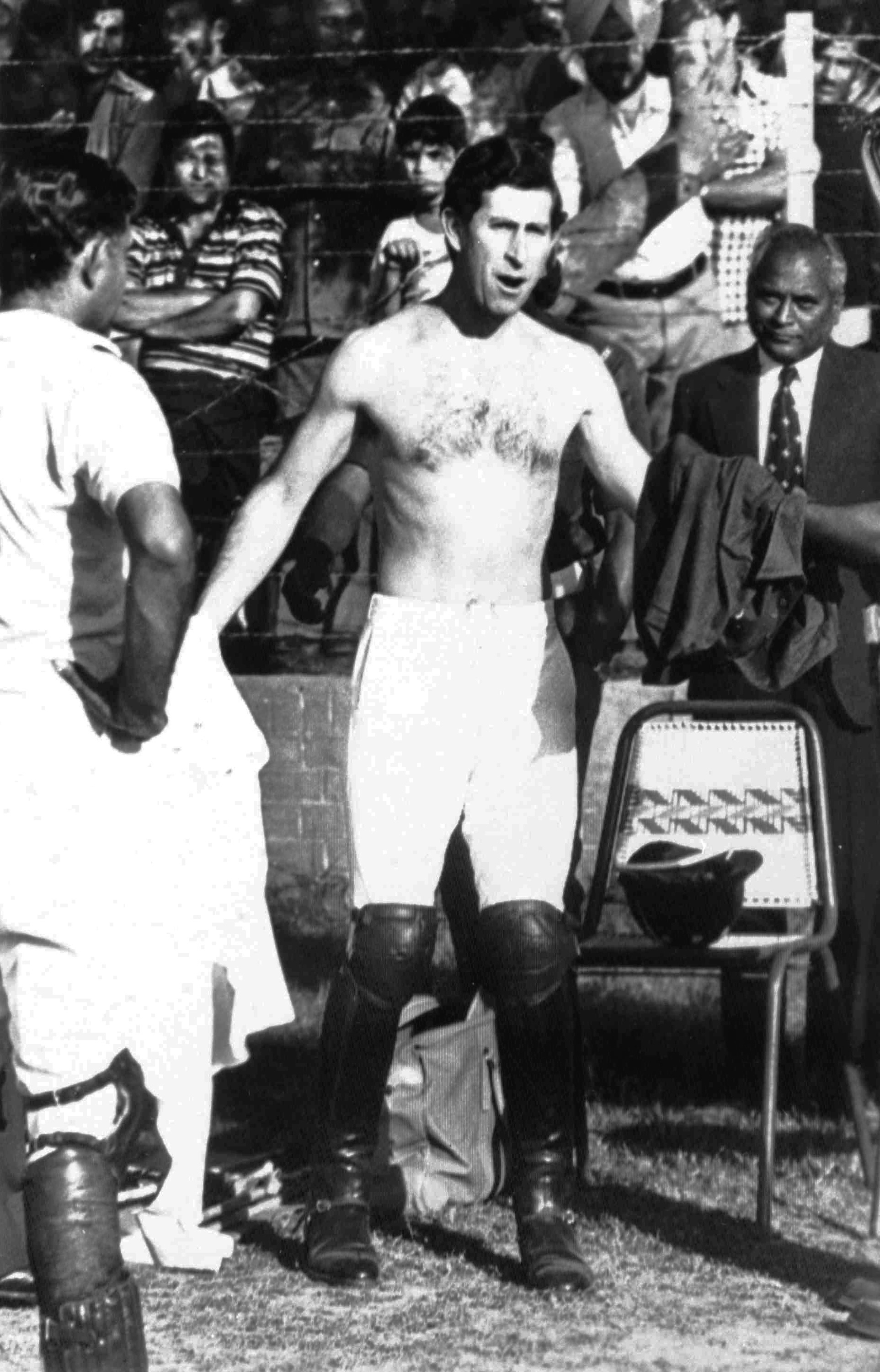 FILE - In this Nov. 26, 1980 file photo Britain's Prince Charles changes his shirt at the end of a polo match in New Delhi, India. Prince Charles has been preparing for the crown his entire life. Now, that moment has finally arrived. Charles, the oldest person to ever assume the British throne, became king on Thursday Sept. 8, 2022, following the death of his mother, Queen Elizabeth II. (AP Photo, File)