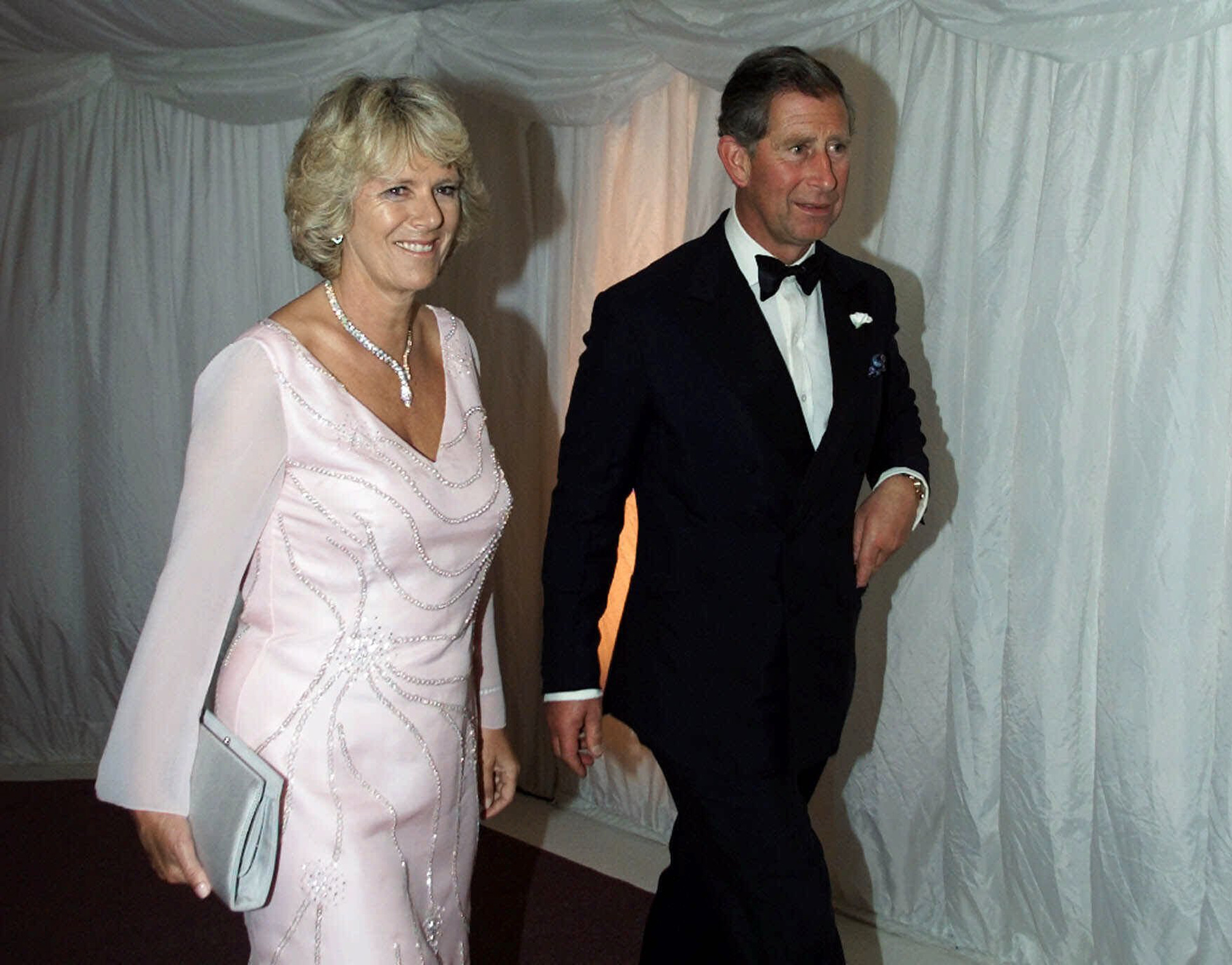 FILE - In this Tuesday, June 20, 2020 file photo, Britain's Prince Charles and Camilla Parker Bowles walk to the gala dinner at The Prince's Foundation in London. Prince Charles has been preparing for the crown his entire life. Now, that moment has finally arrived. Charles, the oldest person to ever assume the British throne, became king on Thursday Sept. 8, 2022, following the death of his mother, Queen Elizabeth II. (Christine Nesbitt, Pool via AP,  File)