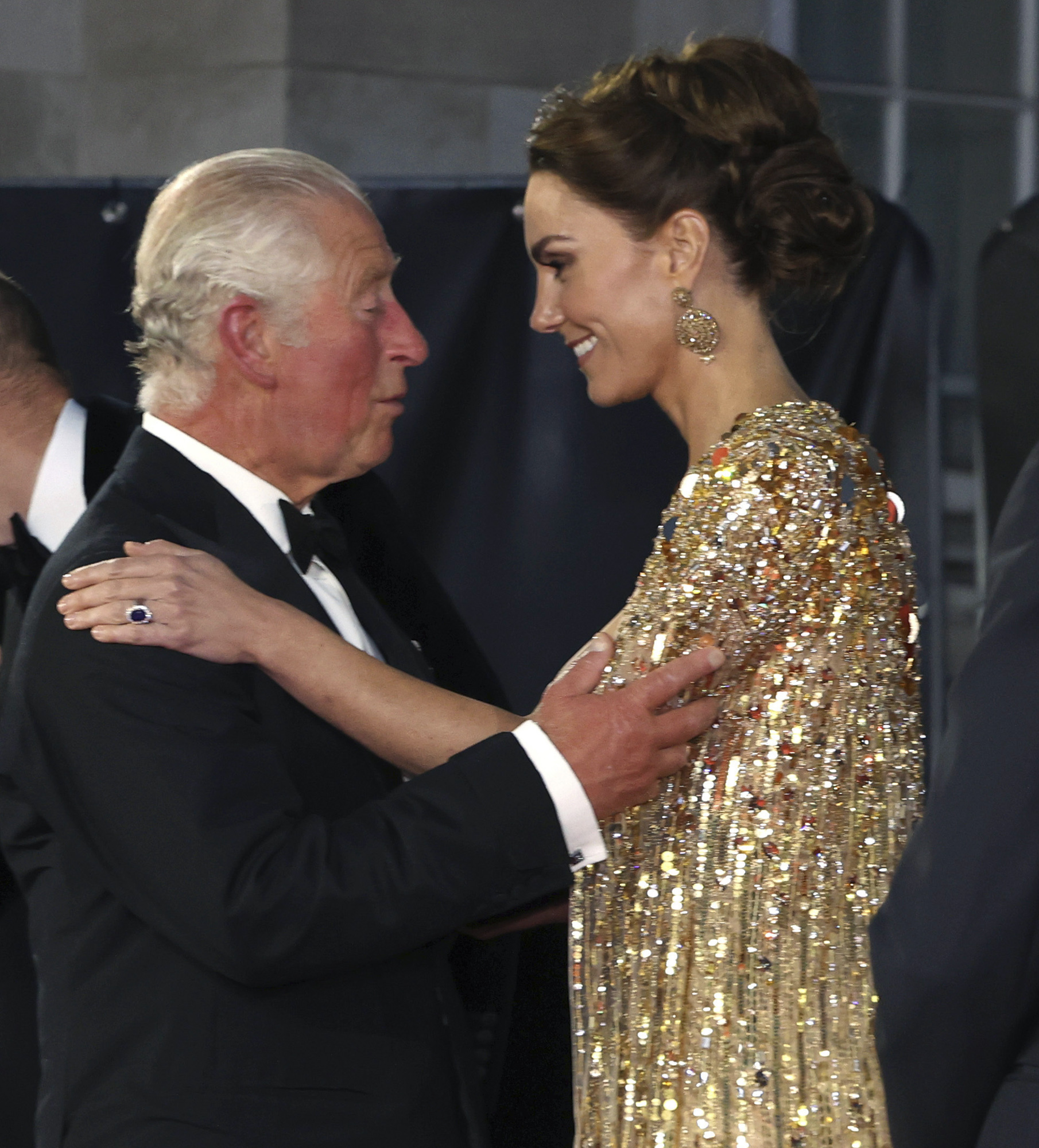 FILE - In this Tuesday, Sept. 28, 2021 file photo, Britain's Prince Charles, left, speaks with Kate, the Duchess of Cambridge as they arrive for the World premiere of the new film from the James Bond franchise 'No Time To Die', in London. Prince Charles has been preparing for the crown his entire life. Now, that moment has finally arrived. Charles, the oldest person to ever assume the British throne, became king on Thursday Sept. 8, 2022, following the death of his mother, Queen Elizabeth II. (Chris Jackson/Pool Photo via AP, File)
