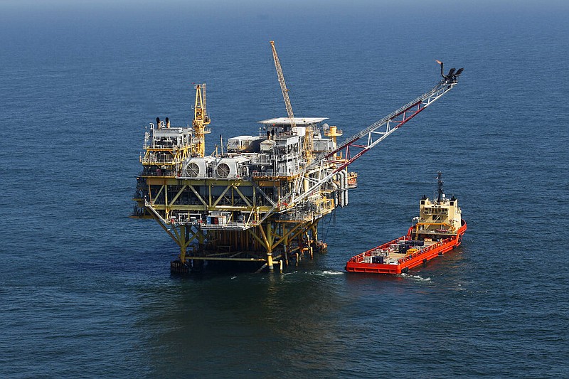 A rig and supply vessel are pictured in the Gulf of Mexico, off the cost of Louisiana on April 10, 2011. (AP/Gerald Herbert, File)