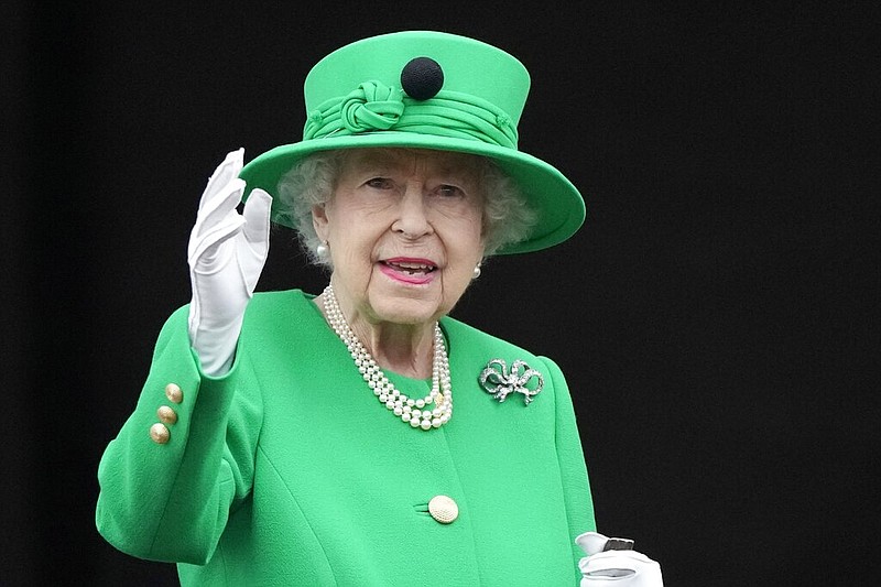 FILE - Queen Elizabeth II waves to the crowd during the Platinum Jubilee Pageant at the Buckingham Palace in London, Sunday, June 5, 2022, on the last of four days of celebrations to mark the Platinum Jubilee.  Queen Elizabeth II, Britainâ€™s longest-reigning monarch and a rock of stability across much of a turbulent century, has died. She was 96. Buckingham Palace made the announcement in a statement on Thursday Sept. 8, 2022. (AP Photo/Frank Augstein, File)