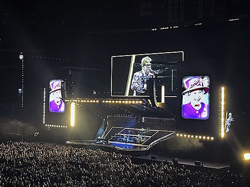 Elton John paid tribute Thursday night to Queen Elizabeth II at his final concert in Toronto, saying she inspired him and is sad she is gone. “She led the country through some of our greatest and darkest moments with grace and decency and genuine caring,” he said. More photos at arkansasonline.com/910elizabeth/.
(AP/Robert Gillies)
