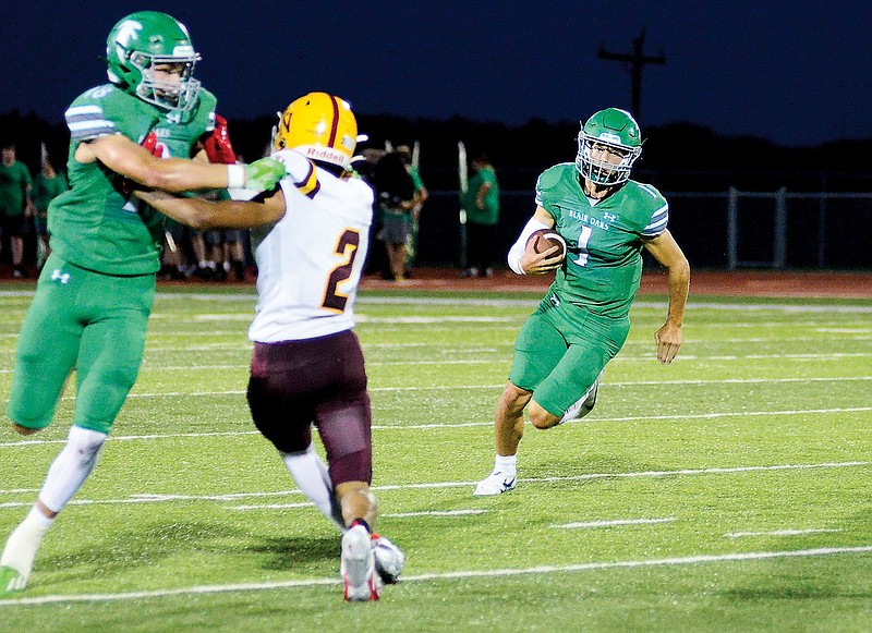 Dylan Hair of Blair Oaks runs with the ball during last Friday night’s game against Lutheran North at the Falcon Athletic Complex in Wardsville. (Eileen Wisniowicz/News Tribune)