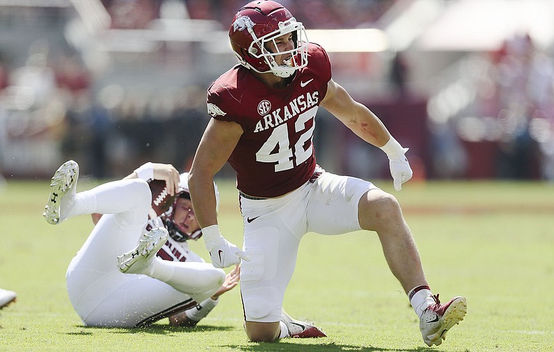 Arkansas linebacker Drew Sanders celebrates after tackling South Carolina quarterback Spencer Rattler behind the line in the second quarter of Saturday’s game in Fayetteville.
(NWA Democrat-Gazette/Charlie Kaijo)