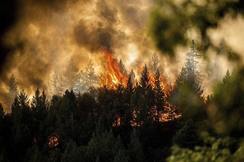 The Mosquito Fire burns along a ridge top in unincorporated Placer County, Calif., last week.
(AP/Noah Berger)