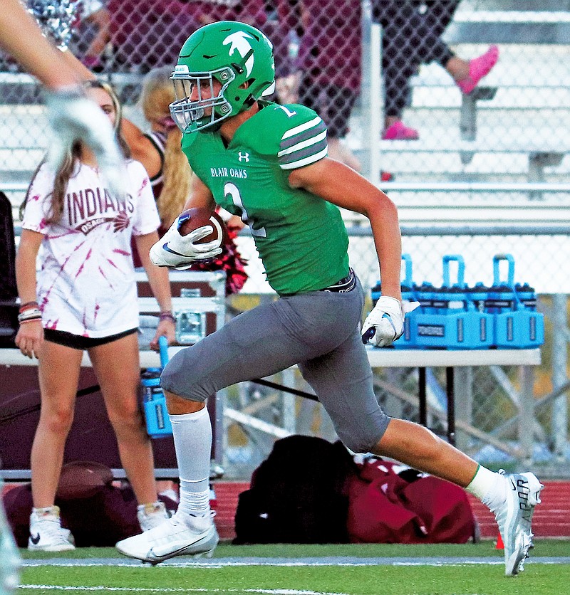 Blair Oaks wide receiver Alec Wieberg runs after making a catch during Friday night’s game against School of the Osage at the Falcon Athletic Complex in Wardsville. (Kate Cassady/News Tribune)