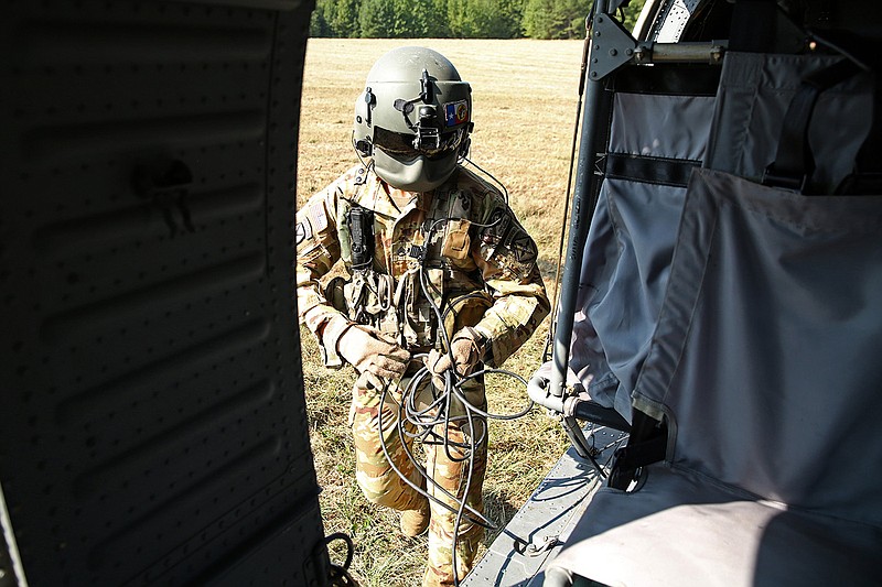 FILE — Arkansas National Guard Staff Sgt. Piero Lopez prepares for takeoff on a Blackhawk helicopter during an Arkansas National Guard training exercise with the North Little Rock Fire Department in a field near the North Little Rock Airport in this Sept. 14, 2022 file photo. See more photos at arkansasonline.com/915helicopter/ (Arkansas Democrat-Gazette/Colin Murphey)