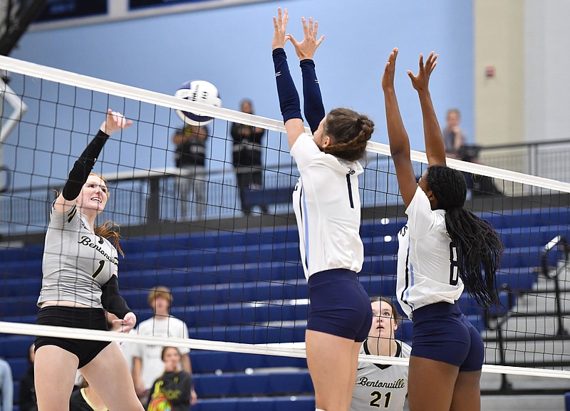 Bentonville's Madison Lee (left) sends the ball over the net Tuesday, Sept. 13, 2022, as Har-Ber's Brooklyn Ware (center) and Korlynn Hall (8) reach to defend during the first set in Wildcat Arena in Springdale. Visit nwaonline.com/220914Daily/ for today's photo gallery. .(NWA Democrat-Gazette/Andy Shupe)