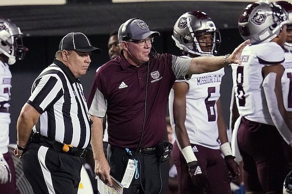 Missouri State coach Bobby Petrino talks with an official during the second half of the team's NCAA college football game against Oklahoma State, Saturday, Sept. 4, 2021, in Stillwater, Okla. (AP Photo/Sue Ogrocki)