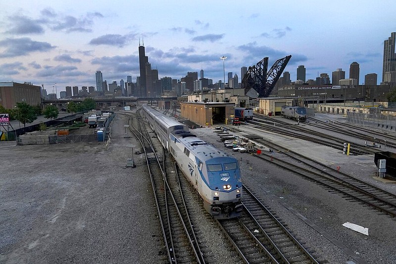 FILE - An Amtrak passenger train departs Chicago in the early evening headed south Wednesday, Sept. 14, 2022, in Chicago. (AP/Charles Rex Arbogast, File)