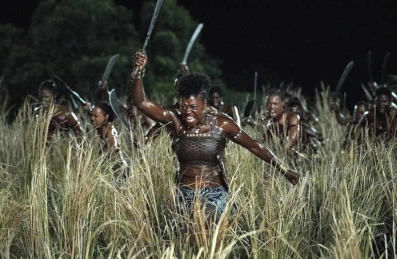 Brush cut: Gallant General Nanisca (Viola Davis) leads the Agojie into battle in director Gina Prince-Bythewood’s factbased (if grammatically challenged) action-adventure “The Woman King.”