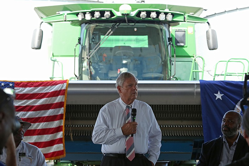 U.S. Department of Agriculture Secretary Tom Vilsack attends a panel discussion at Isbell Farms in England on Friday to discuss the Climate Smart Agriculture Initiative designed to support pilot programs to help farmers transition to sustainable farming practices.
(Arkansas Democrat-Gazette/Colin Murphey)