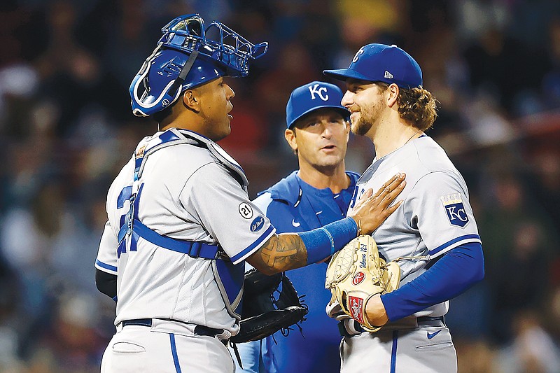 Royals catcher Salvador Perez pats Jonathan Heasley on the chest as manager Mike Matheny comes to the mound to remove Heasley during the seventh inning of Friday night's game against the Red Sox at Fenway Park in Boston. (Associated Press)