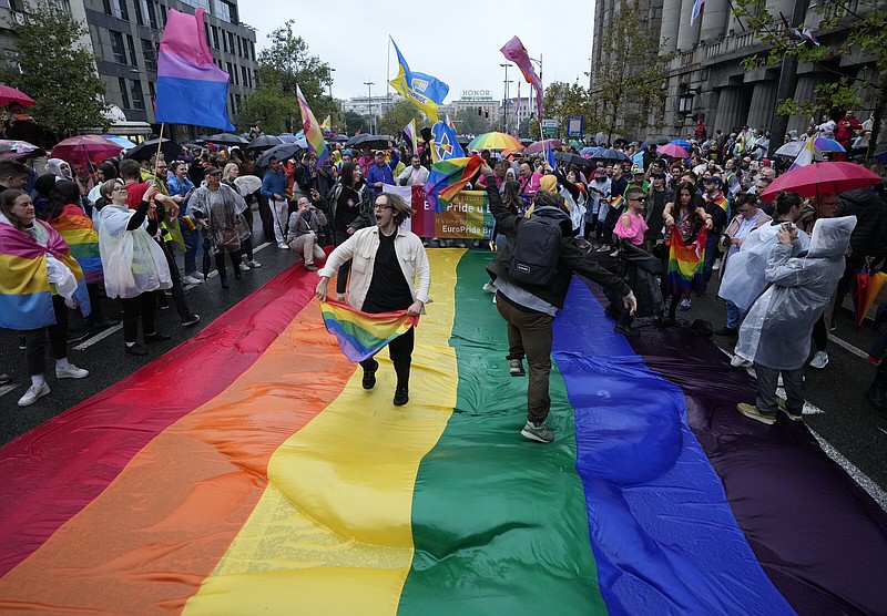 People take part in the European LGBTQ pride march Saturday in Belgrade, Serbia. Serbian police have banned Saturday’s parade, citing a risk of clashes with far-right activists. More photos at arkansasonline.com/918belgrade/
(AP/Darko Vojinovic)