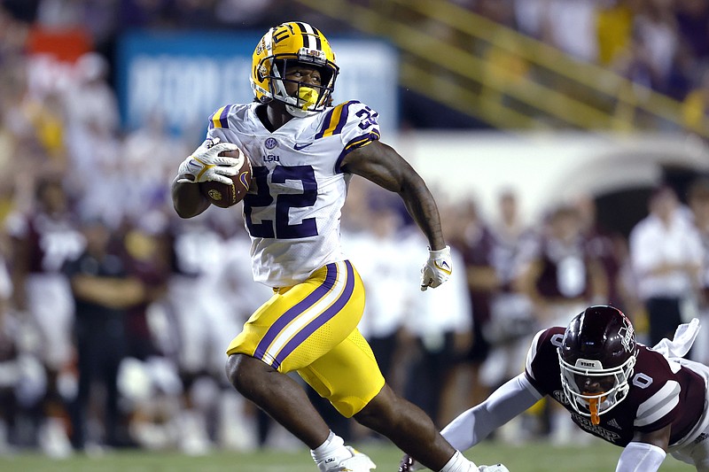 LSU running back Armoni Goodwin (22) carries the ball past Mississippi State safety Jalen Green (0) to score a touchdown during the second half of an NCAA college football game in Baton Rouge, La., Saturday, Sept. 17, 2022. LSU won 31-16. (AP Photo/Tyler Kaufman)