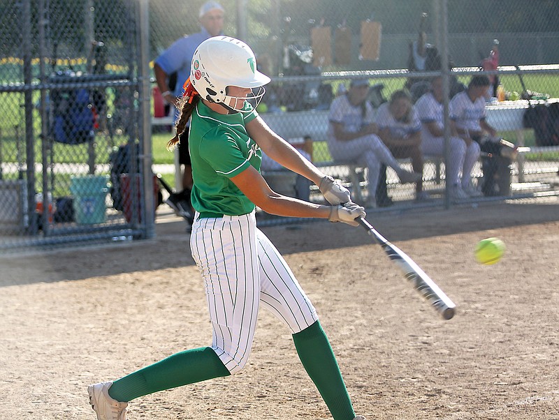 Blair Oaks pinch hitter Morgan Luebbering connects for a walk-off RBI single in the seventh inning of Saturday’s fifth-place game against Father Tolton in the Lady Jays Classic at Binder Park. (Greg Jackson/News Tribune)