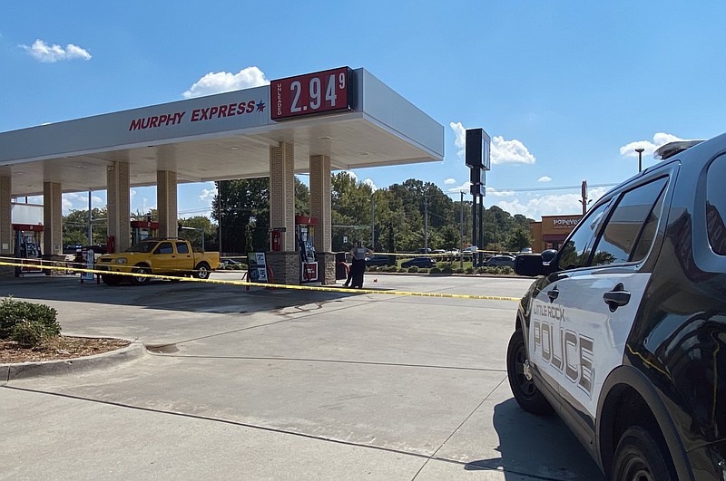The Little Rock Police Department investigates the scene of a shooting at the Murphy Express near the intersection of Baseline and Interstate 30 Frontage roads on Sunday afternoon, Sept. 18, 2022. (Arkansas Democrat-Gazette/Staci Vandagriff)