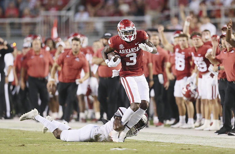 Arkansas wide receiver Matt Landers (3) carries the ball, Saturday, September 17, 2022 during the second quarter of a football game at Donald W. Reynolds Razorback Stadium in Fayetteville. Visit nwaonline.com/220918Daily/ for today's photo gallery...(NWA Democrat-Gazette/Charlie Kaijo)
