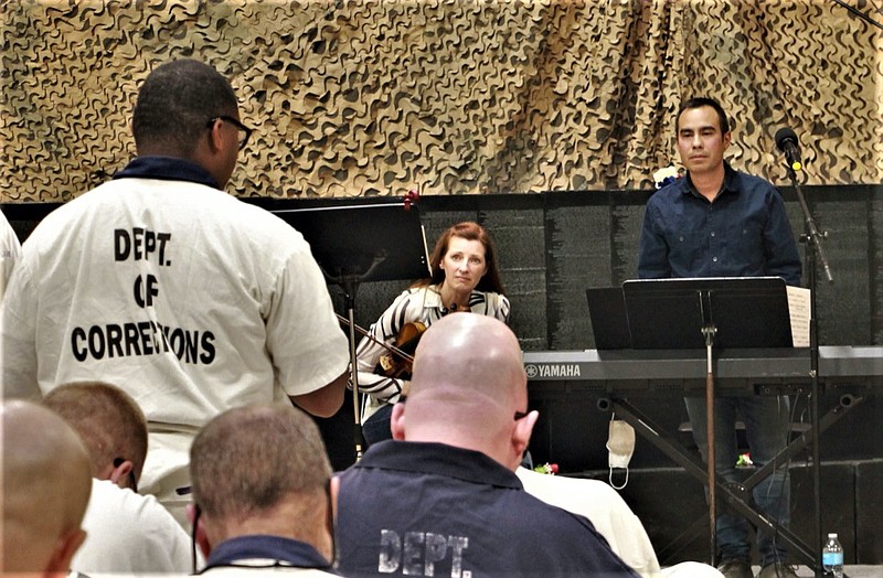 Walker State Prison / Inmates listen to a concert by violinist Holly Mulcahy at Walker State Prison in Rock Spring, Ga. Mulcahy has led an effort to start a program of violin lessons for the inmates.