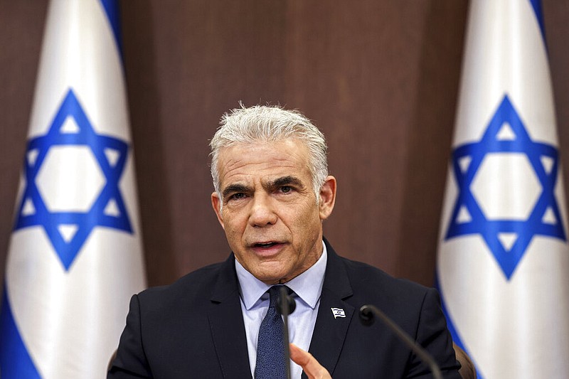 Israel's Prime Minister Yair Lapid attends the weekly cabinet meeting in Jerusalem, on Sept. 18, 2022. (Ronaldo Schemidt/Pool Photo via AP)