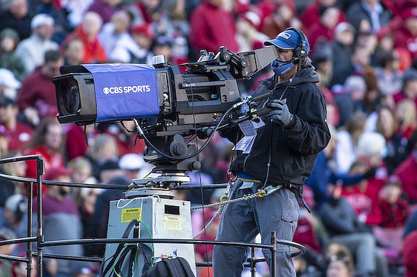 A CBS cameraman is shown during a game between Arkansas and Missouri on Friday, Nov. 26, 2021, in Fayetteville.
