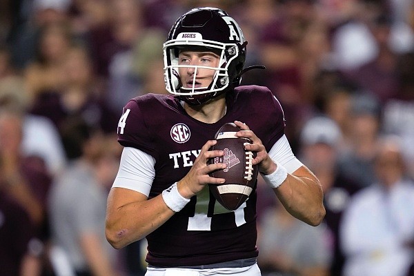 Texas A&M quarterback Max Johnson looks for a receiver during the first quarter of the team's NCAA college football game against Miami on Saturday, Sept. 17, 2022, in College Station, Texas. (AP Photo/Sam Craft)