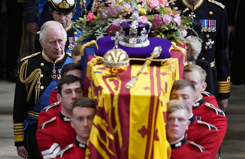 King Charles III and members of the Royal family follow behind the coffin of Queen Elizabeth II, draped in the Royal Standard with the Imperial State Crown and the Sovereign's orb and sceptre, as it is carried out of Westminster Abbey after her State Funeral, in London, Monday Sept. 19, 2022.(Danny Lawson/Pool Photo via AP, File)