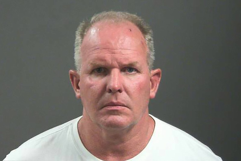 This photo provided by Washington County, Arkansas shows Douglas Ramsey.  Officials say Ramsey, a vegan food products company executive has been charged with felony battery and making a terroristic after a fracas outside a football game in which he's accused of biting a man's nose.  Ramsey, Beyond Meat Chief Operations Officer,  is accused in the road rage attack outside Saturday, Sept. 17, 2022, game in Fayetteville between the Arkansas Razorbacks and Missouri State Bears.   (Washington County, Arkansas Sheriff's Office via AP)