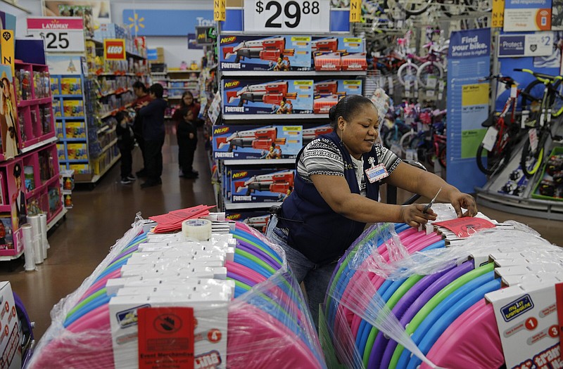 A Walmart employee labels items in preparation for a sale at a Walmart Supercenter in Las Vegas in this file photo.
(AP)