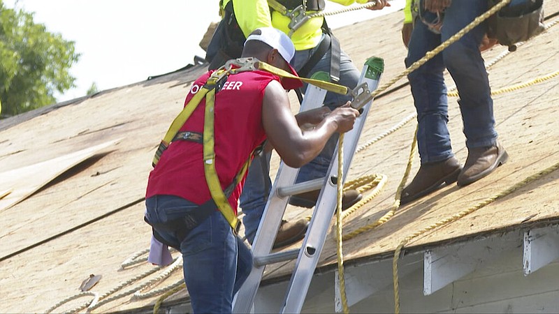 In this image taken from a video, actor Anthony Mackie, who portrays Captain America in an upcoming film, is seen in New Orleans on Monday, Sept. 12, 2022. Mackie grew up working in the family roofing business and is now teaming up with roofing company GAF to fix roofs for homeowners who sustained damage during last year's Hurricane Ida. (AP Photo/Stephen Smith)