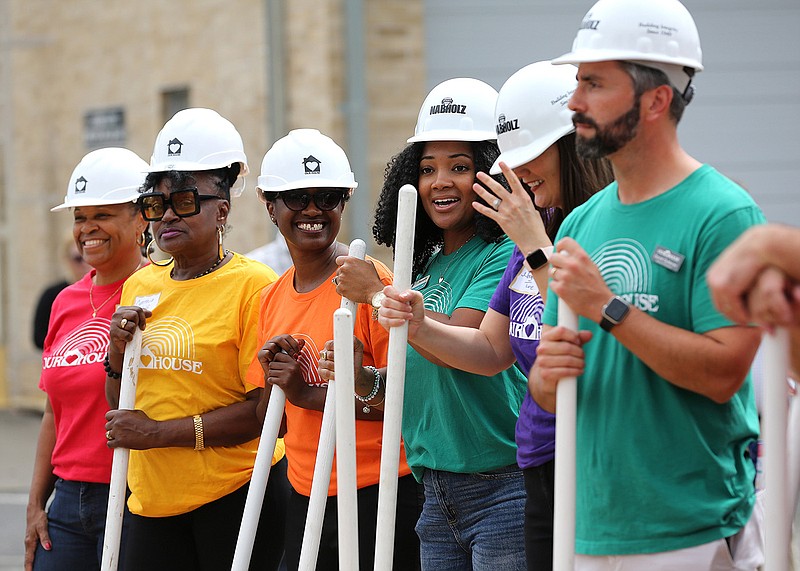 Our House board members line up for a photo Thursday after the groundbreaking ceremony for its $16 million expansion project in Little Rock. More photos at arkansasonline.com/923ourhouse/.
(Arkansas Democrat-Gazette/Thomas Metthe)