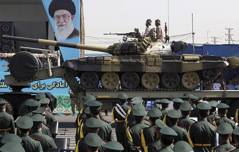 A T-72 tank of Iran’s paramilitary Revolutionary Guard is driven Thursday past a portrait of Supreme Leader Ayatollah Ali Khamenei during a military parade commemorating the anniversary of the start of the 1980-88 Iraq-Iran war, just outside Tehran, Iran.
(AP/Vahid Salemi)