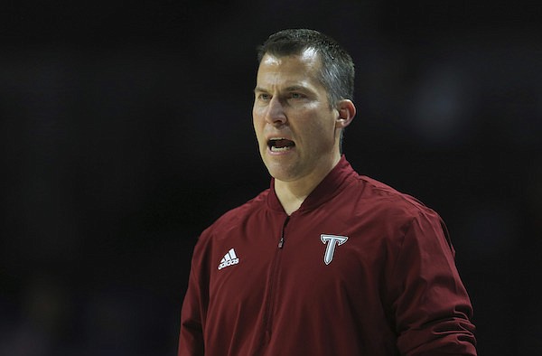 Troy head coach Scott Cross reacts during the first half of an NCAA college basketball game against Florida, Sunday, Nov. 28, 2021, in Gainesville, Fla. (AP Photo/Matt Stamey)
