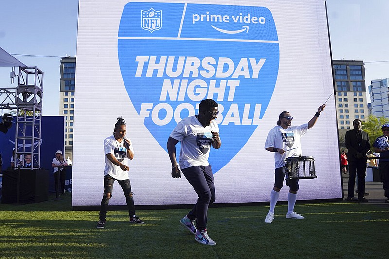 AP photo by Vera Nieuwenhuis / Robert "Bojo" Ackah, center, and Fik-Shun, left, perform on April 28 at the NFL draft in Las Vegas during the announcement of the first "Thursday Night Football on Prime Video" matchup. The Kansas City Chiefs beat the Los Angeles Chargers on Sept. 15 to kick off Amazon Prime Video's 11-year agreement with the NFL to carry 15 Thursday night games each season.