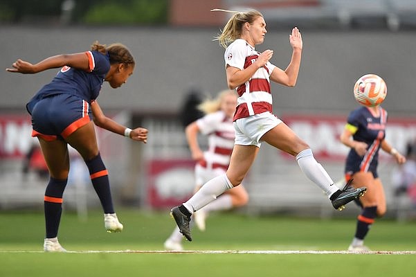 Arkansas' Anna Podojil (right) deflects a pass Thursday, Sept. 22, 2022, from Auburn's Hayden Colson during the first half of play at Razorback Field on the university campus in Fayetteville.