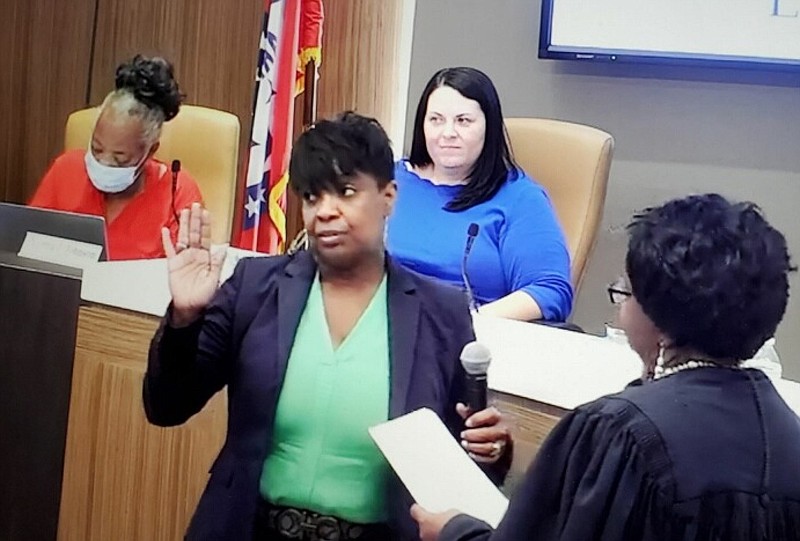 In this screenshot from video, Joyce Walker Wesley is sworn in to the Little Rock School Board by Pulaski County Circuit Judge Alice Gray on Thursday, Sept. 22, 2022 as board member Leigh Ann Wilson looks on. Wesley has been appointed to fill the Zone 9 seat vacated by Jeff Wood, and she is unopposed for election Nov. 8 to the same seat. (Courtesy image)