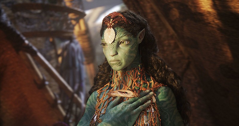 Princess Neytiri te Tskaha Mo’at’ite (voiced by Zoe Saldana) saves Jake Sully — an earthling spying on her people for a force trying to drive them off their land in order to steal their unobtanium — from a pack of viperwolves and trains him in the ways of the Na’vi in James Cameron’s “Avatar,” which is returning to theaters this week.