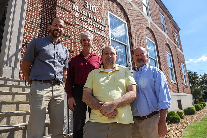 Staff photo by Olivia Ross / Michael Hutcherson, Scott McKenzie, Brian Horne, and Jeff Westbrook of March Adams & Associates pose for a portrait outside of their office on Dodds Avenue on September 14, 2022.