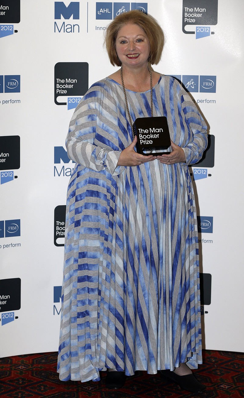 Hilary Mantel, winner of the Man Booker Prize for Fiction, poses with her prize for the photographers shortly after the award ceremony in central London, Tuesday, Oct. 16, 2012.
(AP Photo/Lefteris Pitarakis)