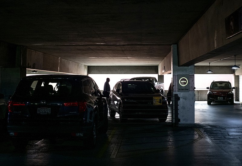 An office worker leaves a parking garage in Columbus, Ohio, in July. After months of working at home for pandemic precautions, more employees are returning to the office.
(The New York Times/Ty Wright)