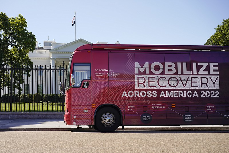 The Mobilize Recovery bus is parked on Pennsylvania Avenue in front of the White House in Washington, Friday, Sept. 23, 2022. Members of Mobilize Recover and others are in Washington to meet with Doug Emhoff, husband of Vice President Kamala Harris, to give their recommendations for the distribution of the federal settlement money as billions of dollars in opioid lawsuit settlements are starting to flow to governments. (AP Photo/Carolyn Kaster)