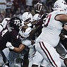Arkansas quarterback KJ Jefferson fumbles during a game against Texas A&M on Saturday, Sept. 24, 2022, in Arlington, Texas. The Aggies returned the fumble 97 yards for a touchdown.