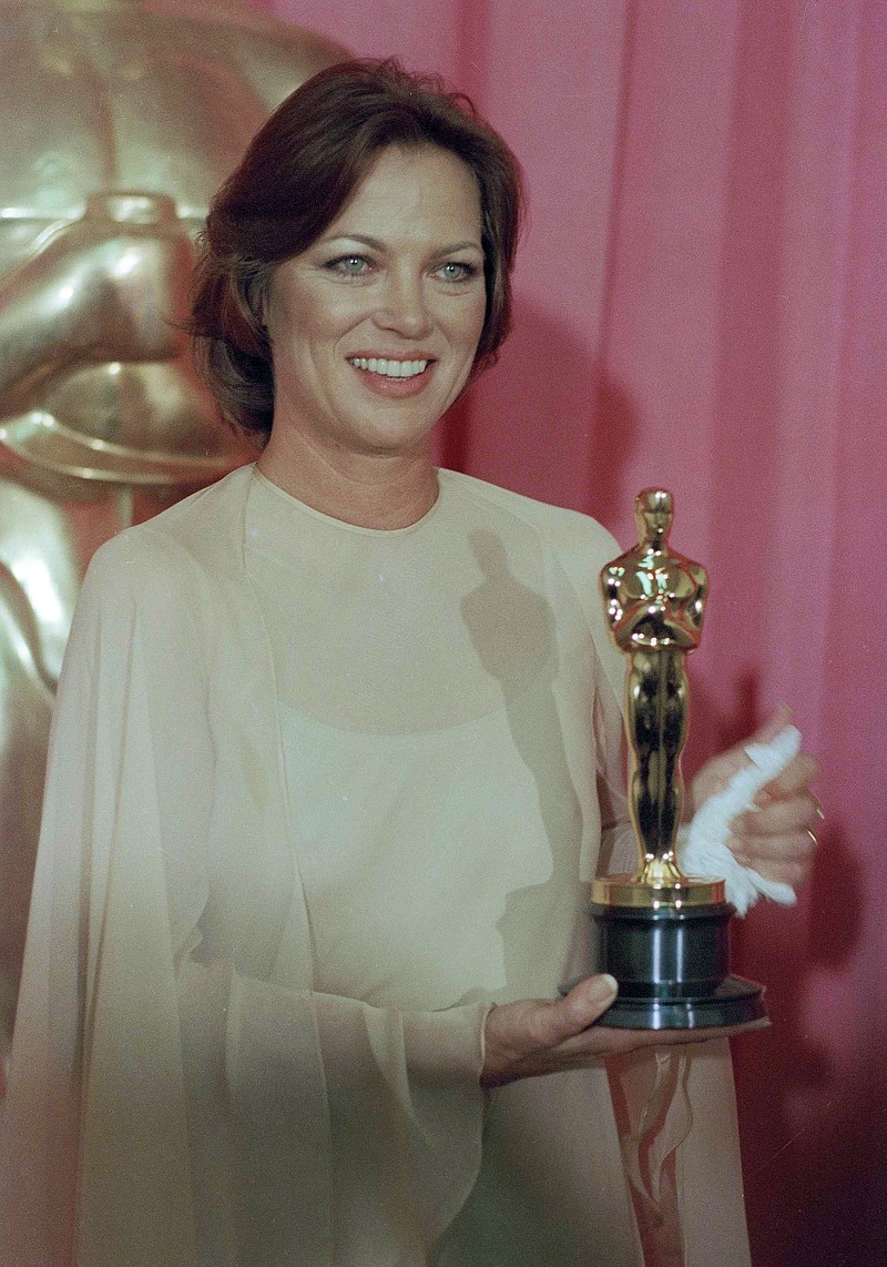 Louise Fletcher holds the Academy Award she won for her leading role in "One Flew Over The Cuckoo's Nest" in Los Angeles, March 30, 1976. (AP Photo/File)