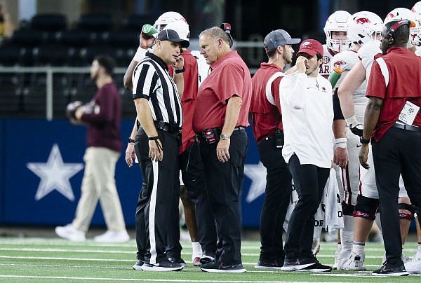 Arkansas head coach Sam Pittman talks to an official, Saturday, September 23, 2022 during the second quarter of a football game at AT&T Stadium in Arlington, Texas. Visit nwaonline.com/220924Daily/ for today's photo gallery.......(NWA Democrat-Gazette/Charlie Kaijo)