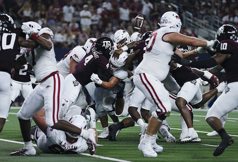 Arkansas quarterback KJ Jefferson (1) loses the ball as he leaps towards the end resulting in a Texas A&M score, Saturday, September 23, 2022 during the second quarter of a football game at AT&T Stadium in Arlington, Texas. Visit nwaonline.com/220924Daily/ for today's photo gallery...(NWA Democrat-Gazette/Charlie Kaijo)