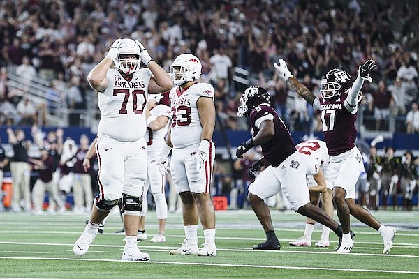 Arkansas and Texas A&M players react after Cam Little missed a field goal in the closing minutes of the Razorbacks' 23-21 loss to the Aggies on Saturday, Sept. 24, 2022, in Arlington, Texas.